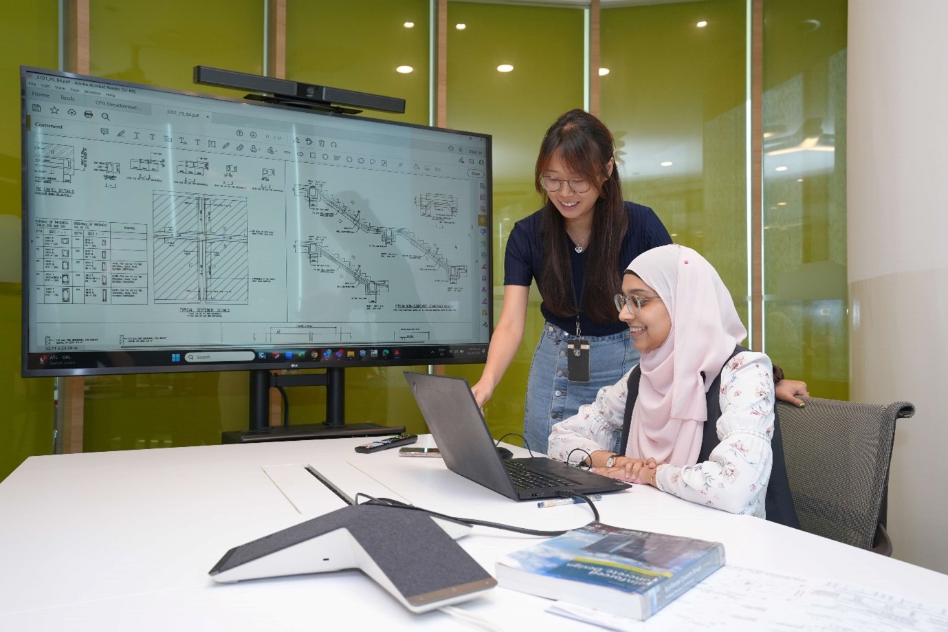 Rabia reviewing structural design with a Principal Engineer from her team
